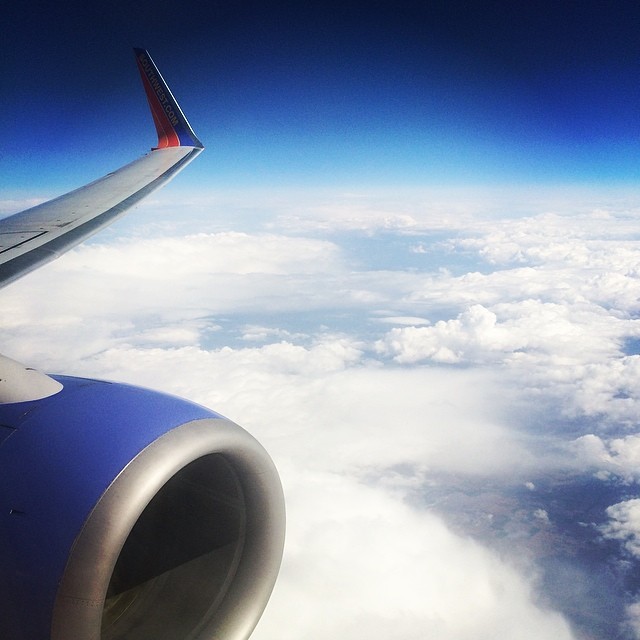 Greetings from the sky ️ Beyond excited to be coming home! #inflight #skyscapes #planewindow