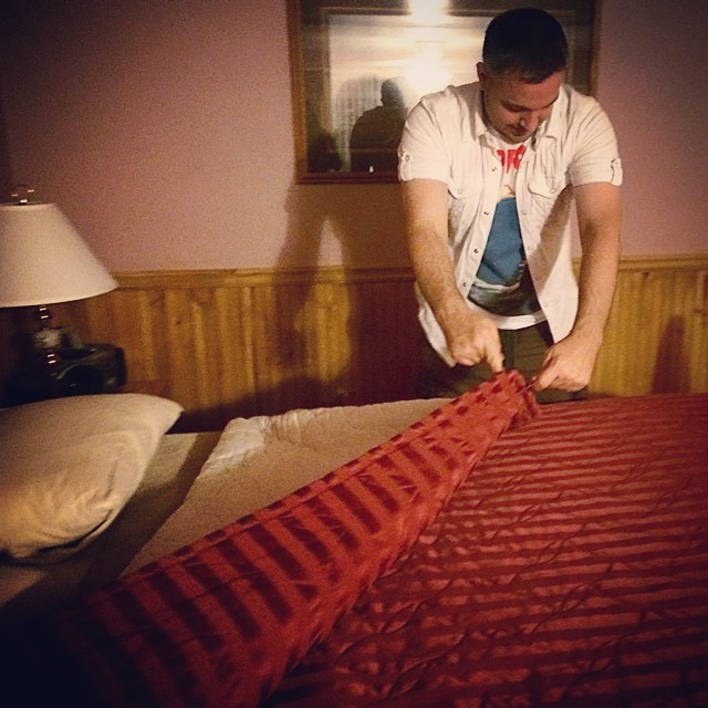 Max using forks to remove the dubious motel bed spread. #foreverunclean #laketahoe