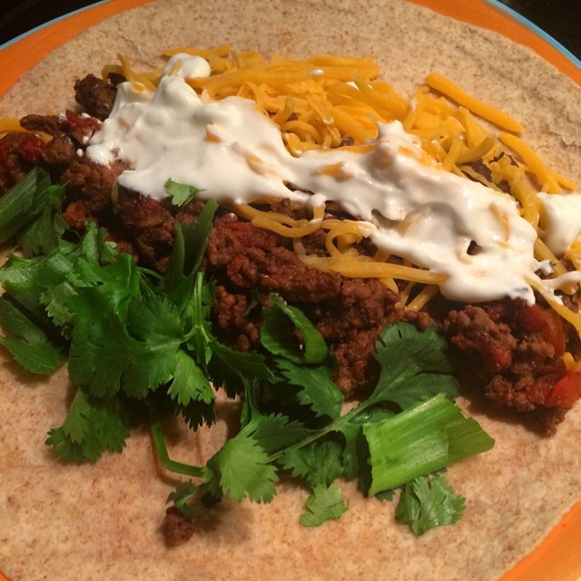 More food ️ #macro friendly #burritos! 90% lean ground beef cooked with tomatoes and chilis with Mrs Dash taco seasoning, fat free cheddar, fat free Greek yogurt and cilantro+green onions. I used an Extreme Wellness high fiber wrap. So spicy and delish #macros for one #burrito- 336 cals, 17C, 39P, 10F, 9 fiber #iifym #contestprep #eatforabs #macrofriendly #bikiniprep