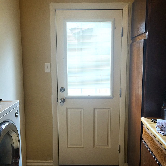 After!! So much better. You can't tell much by the photo, but the first door was framed in so poorly. Huge improvement and a much nicer door! The blinds are even built in to the window pane  #homeremodel #renovations #remodeling #newdoor #9lite #ninelite #blinds #lowes #homeimprovement #homeowner